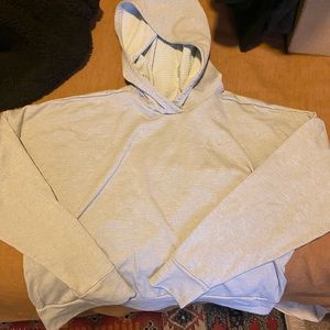 Nike cropped grey running hoodie. Reflective stripe on back, good condition